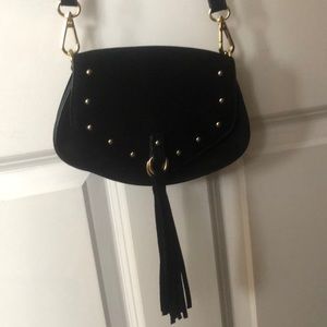 Black bag with gold studs and fringe